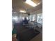 Community workout room with treadmills, weight machines, ceiling fans and natural light from multiple windows at 8101 Coconut Palm Way # 303, Kissimmee, FL 34747