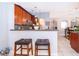 Kitchen with granite countertops, wooden cabinets, and stainless steel appliances at 812 Adour Dr, Kissimmee, FL 34759