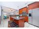 Modern kitchen featuring a center island, stainless steel appliances, and sleek cabinetry at 812 Adour Dr, Kissimmee, FL 34759