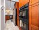 Kitchen area featuring stainless steel refrigerator and built in oven at 812 Adour Dr, Kissimmee, FL 34759