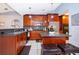 Beautiful kitchen with dark wood cabinets, granite countertops, and center island at 812 Adour Dr, Kissimmee, FL 34759