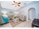 Inviting living room featuring tile floors, modern decor, and ample natural light, creating a cozy atmosphere at 812 Adour Dr, Kissimmee, FL 34759
