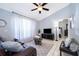 Inviting living room with stylish decor, large window, and comfortable seating at 812 Adour Dr, Kissimmee, FL 34759