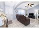 Cozy living room with neutral paint, modern furniture, and ample natural light at 812 Adour Dr, Kissimmee, FL 34759