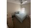 Cozy bedroom featuring neutral walls, a ceiling fan, and carpeted flooring at 939 Jaybee Ave, Davenport, FL 33897