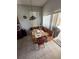 Charming breakfast nook with a wooden booth, chairs, and a decorative light fixture at 939 Jaybee Ave, Davenport, FL 33897