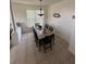 Elegant dining room with a large table, comfortable chairs, and natural light at 939 Jaybee Ave, Davenport, FL 33897