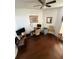 Bright office space with wood floors, a ceiling fan, and furniture at 939 Jaybee Ave, Davenport, FL 33897