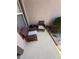 Cozy patio space with comfortable wicker chairs, perfect for relaxing outdoors at 939 Jaybee Ave, Davenport, FL 33897