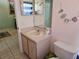 Bathroom sink and toilet with decor at 1006 Soaring Eagle Ln, Kissimmee, FL 34746