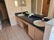 Double sink vanity in bathroom with tile floor at 1006 Soaring Eagle Ln, Kissimmee, FL 34746