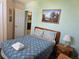 Bedroom with a bed and nightstand at 1006 Soaring Eagle Ln, Kissimmee, FL 34746