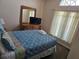 Bedroom with a window, bed and dresser at 1006 Soaring Eagle Ln, Kissimmee, FL 34746