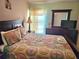 Bedroom with a bed, dresser, and window at 1006 Soaring Eagle Ln, Kissimmee, FL 34746