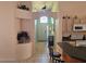 Inviting foyer with decorative features and arched entryway, leading into a tiled hallway and light-filled living space at 1006 Soaring Eagle Ln, Kissimmee, FL 34746