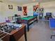 Entertaining game room featuring a pool table, foosball table, and ping pong table at 1006 Soaring Eagle Ln, Kissimmee, FL 34746