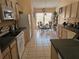 Bright kitchen with tile floors, modern appliances, light wood cabinets and eat-in dining area at 1006 Soaring Eagle Ln, Kissimmee, FL 34746