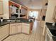 Well-lit kitchen featuring stainless steel appliances and an open layout connected to the living area at 1006 Soaring Eagle Ln, Kissimmee, FL 34746