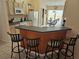 Bright kitchen with modern appliances, neutral cabinetry, breakfast bar, and adjacent dining area, perfect for casual dining at 1006 Soaring Eagle Ln, Kissimmee, FL 34746