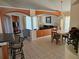 Spacious living room featuring an open floor plan, tile flooring, stylish columns, and comfortable seating area at 1006 Soaring Eagle Ln, Kissimmee, FL 34746