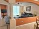 Cozy living room featuring comfortable seating, tile floors, and sliding glass doors to the patio at 1006 Soaring Eagle Ln, Kissimmee, FL 34746