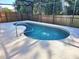 Beautiful in-ground pool with a screened enclosure at 1006 Soaring Eagle Ln, Kissimmee, FL 34746