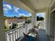 Relax on this balcony with seating while enjoying beautiful neighborhood views at 1020 Siena Park W Blvd # 304, Kissimmee, FL 34747