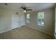 Bedroom with two windows with window coverings and tile floors at 1020 Siena Park W Blvd # 304, Kissimmee, FL 34747