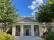 Community center featuring inviting front entrance, complemented by well-maintained landscaping and seating at 1020 Siena Park W Blvd # 304, Kissimmee, FL 34747