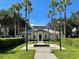 Community center with palm trees, manicured lawns, decorative fountains, and a welcoming entrance at 1020 Siena Park W Blvd # 304, Kissimmee, FL 34747