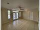 Inviting living room with tile flooring, abundant natural light, and access to a private outdoor patio at 1020 Siena Park W Blvd # 304, Kissimmee, FL 34747