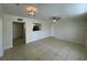 Open-concept living room with tile flooring, ceiling fan, and easy access to other rooms at 1020 Siena Park W Blvd # 304, Kissimmee, FL 34747