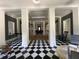 Elegant lobby with black and white checkered floors, columns, and stylish seating areas, offering a modern and inviting space at 1020 Siena Park W Blvd # 304, Kissimmee, FL 34747