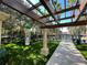 Shaded playground, featuring a slide, climbing area, and surrounding lush greenery at 1020 Siena Park W Blvd # 304, Kissimmee, FL 34747