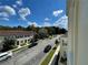 Scenic street view showcasing well-maintained landscaping and charming home facades at 1020 Siena Park W Blvd # 304, Kissimmee, FL 34747