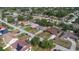 Aerial view of property including the neighboring community and tree coverage at 1022 Blue Horizon Dr, Deltona, FL 32725