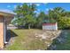 A spacious backyard featuring a shed, lush trees, and potential for creating your outdoor oasis at 1022 Blue Horizon Dr, Deltona, FL 32725
