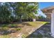 Large backyard with ample shade from mature trees and a storage shed at 1022 Blue Horizon Dr, Deltona, FL 32725