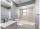 Updated bathroom featuring marble-look tile surround on the tub and newer vanity at 1022 Blue Horizon Dr, Deltona, FL 32725