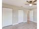 Bedroom featuring fan, closets and doorway at 1022 Blue Horizon Dr, Deltona, FL 32725