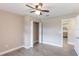 Bedroom featuring fan, closet with bi-fold doors, and doorway at 1022 Blue Horizon Dr, Deltona, FL 32725