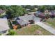 Aerial view of brick house with a large yard and long driveway at 1022 Blue Horizon Dr, Deltona, FL 32725
