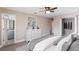 Serene main bedroom features neutral tones, a ceiling fan, walk-in closet, and an ensuite bathroom at 1022 Blue Horizon Dr, Deltona, FL 32725