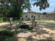Spacious backyard featuring comfortable seating and lush greenery at 1101 28Th Nw St, Winter Haven, FL 33881