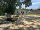 This backyard has a sitting area that is shady and serene at 1101 28Th Nw St, Winter Haven, FL 33881
