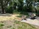 This backyard has a tree stump and plenty of room for outdoor activities at 1101 28Th Nw St, Winter Haven, FL 33881