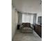 Bedroom featuring neutral walls and floors, natural light, and neutral colored chair at 1101 28Th Nw St, Winter Haven, FL 33881