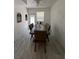 Dining area with a large table, seating for six, and decorative wall accents at 1101 28Th Nw St, Winter Haven, FL 33881