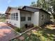 Exterior corner view of a single-story home featuring a fenced yard and landscaping at 1101 28Th Nw St, Winter Haven, FL 33881