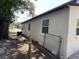 Exterior side view of a single-story home featuring a fenced yard at 1101 28Th Nw St, Winter Haven, FL 33881